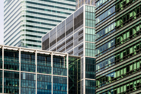 A detailed view of modern corporate buildings with sleek glass facades, reflecting the innovation and professionalism of contemporary business architecture in London UK