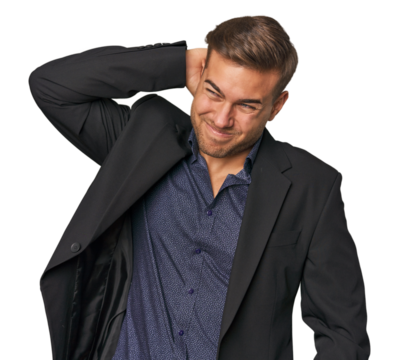 Businessman in suit, studio shot touching back of head, thinking and making a choice.