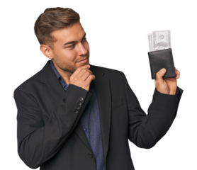 business caucasian man holding tickets looking sideways with doubtful and skeptical expression.