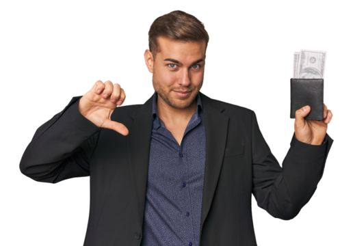 business caucasian man holding tickets showing a dislike gesture, thumbs down. Disagreement concept.