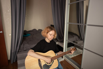 music lessons, Woman learning guitar, playful session, sitting with acoustic guitar, studying music...