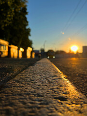 Cobblestone road at sunset, shallow depth of field