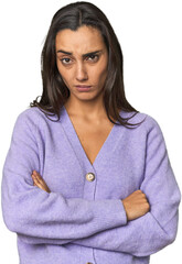 Hispanic young woman unhappy looking in camera with sarcastic expression.