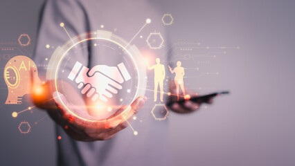 A glowing handshake icon surrounded by futuristic AI elements and digital graphics, symbolizing partnership, technology, innovation, and collaboration in a modern business context.