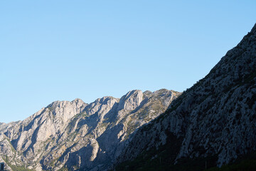 Moody cloudscape over green mountains and bay
