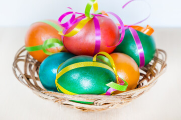 Colored decorated Easter eggs in basket