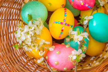 Easter basket with eggs close-up top view