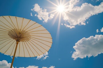 A person holding an open umbrella on a bright and sunny day, enjoying the weather
