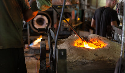 Foundry - ferrous metal is melted in an induction furnace of metallurgical plant