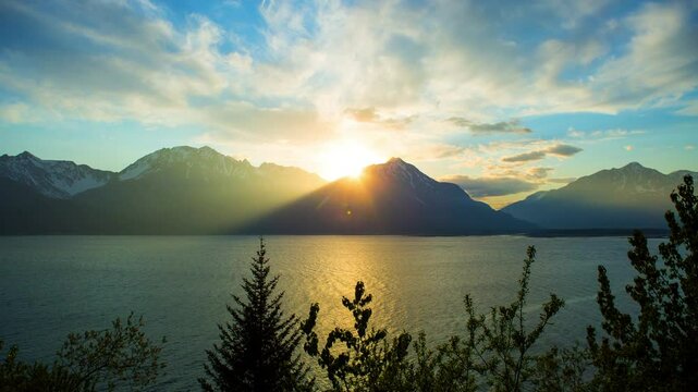Time Lapse Lockdown Shot Of Rippled Lake And Snowcapped Mountains During Sunset - Seward, Alaska