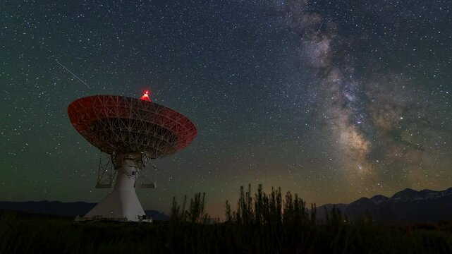 Panning Time Lapse Shot Of Telecommunication Equipment Under Stars At Night - Big Pine, California