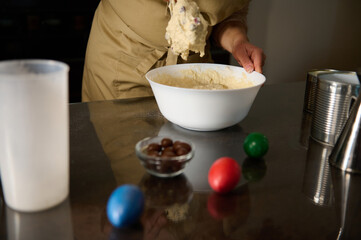 Person Baking With Easter Elements and Colored Eggs in a Kitchen