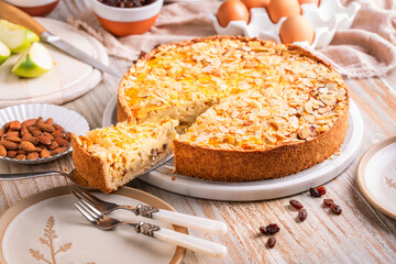 Homemade roasting apple cake with almonds and pudding filling