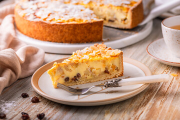 Homemade roasting apple cake with almonds and pudding filling