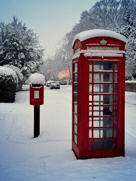 post-box and traditional phone box in the snow 
