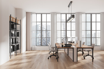 Modern coworking office interior with large windows and minimalist furniture on a wooden floor in a bright urban loft space. 3D Rendering
