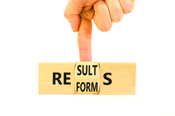 Reform and result symbol. Concept words Reforms Results on beautiful wooden block. Beautiful white table white background. Businessman hand. Business Reforms and results concept. Copy space.