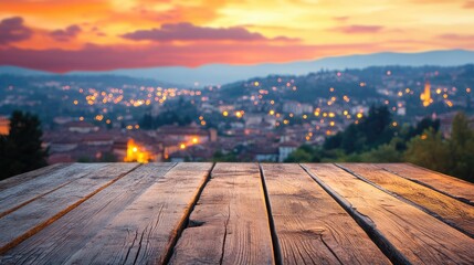 Fototapeta premium Wooden tabletop against a blurred sunset city skyline with glowing lights creating a warm atmospheric background for presentation or display
