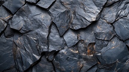 Textured dark gray stone surface ideal for creating banners and backgrounds in design projects. Perfect for modern and minimalist aesthetics.
