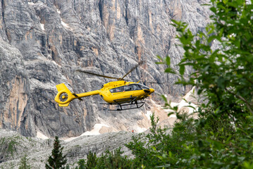 Rescue helicopter providing assistance in the Dolomites in South Tyrol, Italy. © Kozioł Kamila