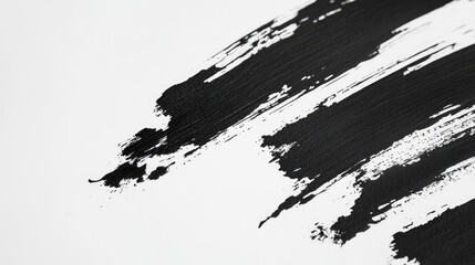 Obraz premium Abstract Black Brushstrokes on White Paper Texture for Creative Artistic Background and Design Elements