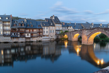 Illuminated Medieval Bridge and Riverside Houses in Espalion, Occitania, France