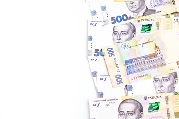 Ukrainian Financial money background. Hryvnia, new banknotes of 500 Hryvnia or UAH forming a frame with white in the middle.
