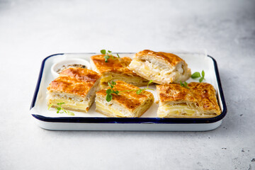 Savory potato pie with cheese and ham
