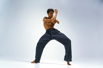 Scantily clad dancer, ballet dancer, man shows dance elements, athletic man
