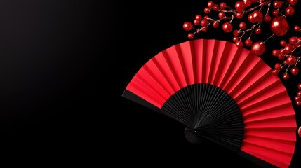 Elegant Red Fan with Decorative Branches Against Black Background