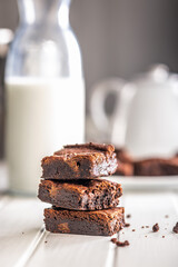 Homemade chocolate brownies on white table.