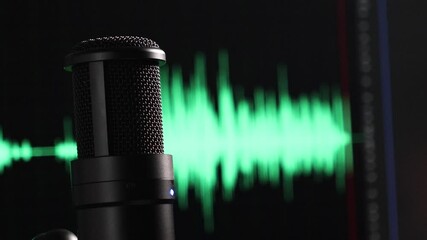 microphone with moving camera capturing audio waveform in the background, emphasizing sound recording and production