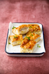 Savory potato pie with cheese and ham