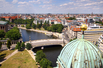 Berlin, Germany - July 9, 2024: View of central Berlin from the Berlin Cathedral, with Museum Island, the Spree River, and iconic city landmarks under a clear summer sky.