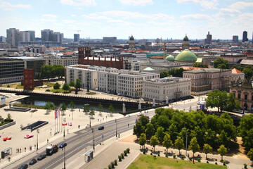 Berlin, Germany - July 9, 2024: View of central Berlin from the Berlin Cathedral, with Museum Island, the Spree River, and iconic city landmarks under a clear summer sky.