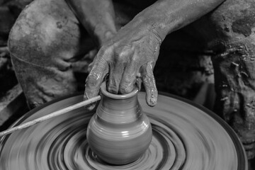 Close up hand of man making clay pottery