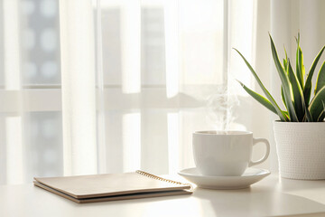 minimalist desk setup with brass hourglass, leather-bound planner, and artisanal coffee cup steaming