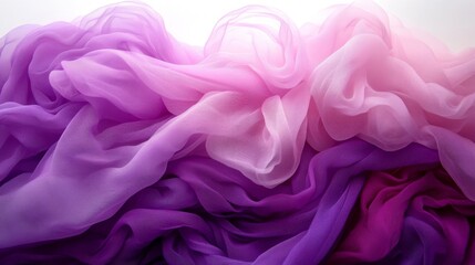 Fototapeta premium Draped ombre chiffon fabric in shades of purple and pink