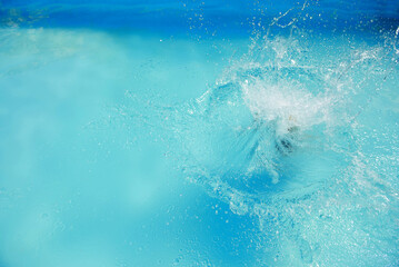 Splash into crystal clear turquoise water of swimming pool