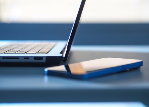 laptop computer with sunlight coming through window
