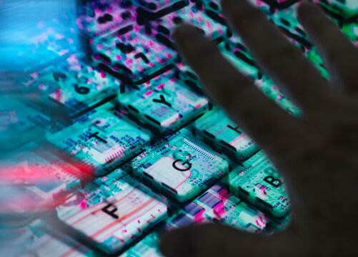 AI technology Landscape, Man typing at laptop with the computer hardware revealed underneath