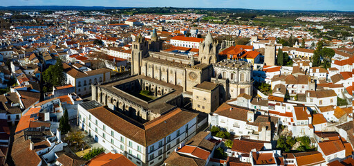 Portugal travel, medieval Evora town Unesco heritage site. Aerial panoramic drone view of down town and cathedral Santa Maria Assunta