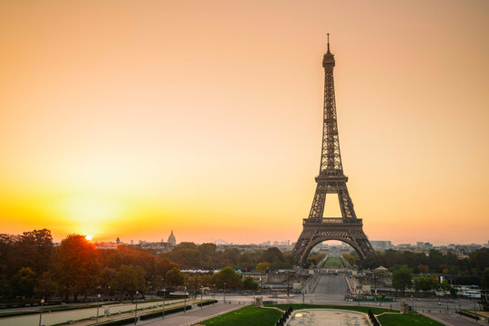 Sunrise behind the Eiffel Tower overlooking the empty Trocadero Gardens in Paris, France