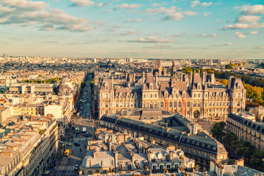 View of Parisian streets with historic buildings and the city hall under a clear sky, Paris, France