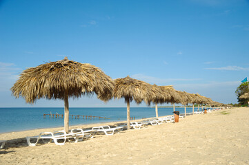 Beach with parasols and sunbeds