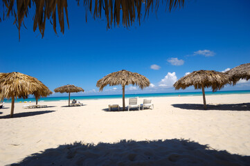 Beach with parasols and sunbeds