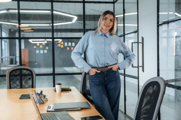 Woman is in the modern office, formal wear