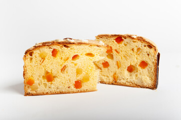 Slice of Panettone fruit cake with diced fruit pieces