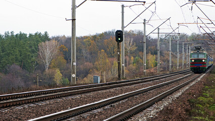 train, electric locomotive. the railway goes into the distance, the rails are sleepers. branch of the high-speed railway. travel, business trip, tourism, long journey. for the holidays. on vacation.
