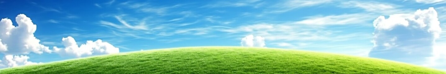 Obraz premium Vibrant green grass under a bright blue sky with fluffy white clouds, creating a perfect outdoor landscape for wallpapers and high-definition backgrounds.